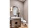 Elegant powder room features quartz countertop and designer accents at 9456 E Sands Dr, Scottsdale, AZ 85255