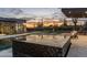 Stunning pool and sun-lounging area against a serene sunset, offering ultimate relaxation with desert views at 9456 E Sands Dr, Scottsdale, AZ 85255