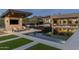 Resort-style pool and lounging area featuring a swim-up bar, comfortable seating, and desert mountain views at 9456 E Sands Dr, Scottsdale, AZ 85255