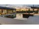 Tranquil swimming pool featuring desert landscaping and lounge area, perfect for evening relaxation and desert sunsets at 9456 E Sands Dr, Scottsdale, AZ 85255