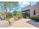Lush backyard with a tranquil pond, well-maintained landscaping, and a private patio area at 10040 E Happy Valley Rd # 243, Scottsdale, AZ 85255