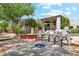 Backyard with outdoor seating area and firepit, pool, and desert landscaping at 10040 E Happy Valley Rd # 243, Scottsdale, AZ 85255