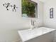 This bathroom showcases a modern freestanding tub with stylish fixtures and a serene outdoor view at 10040 E Happy Valley Rd # 243, Scottsdale, AZ 85255