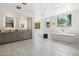 An airy bathroom boasts natural light, a soaking tub, a walk-in shower, and dual vanities at 10040 E Happy Valley Rd # 243, Scottsdale, AZ 85255