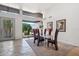 Elegant dining room boasts modern furnishings, neutral colors, and a large window showcasing the desert landscape at 10040 E Happy Valley Rd # 243, Scottsdale, AZ 85255
