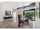 Open-concept dining area with desert view window and modern furnishings and decor at 10040 E Happy Valley Rd # 243, Scottsdale, AZ 85255