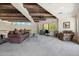 Comfortable loft featuring wood-beamed ceilings, a cozy seating area, and picturesque desert views at 10040 E Happy Valley Rd # 243, Scottsdale, AZ 85255
