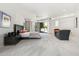 A spacious main bedroom offers plush carpet, patio access, seating, and modern furnishings at 10040 E Happy Valley Rd # 243, Scottsdale, AZ 85255