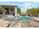 Sparkling pool with desert landscaping and a house that offers both style and comfort at 10040 E Happy Valley Rd # 243, Scottsdale, AZ 85255