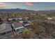 A desert neighborhood features single Gathering homes, mountain views, and privacy fences around landscaped yards at 10775 E Peralta Canyon Dr, Gold Canyon, AZ 85118