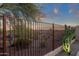 Low metal fence and beautiful desert landscaping offering privacy and a stunning view at 10775 E Peralta Canyon Dr, Gold Canyon, AZ 85118