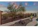 Desert landscape and low fencing complement this property, blending privacy and natural beauty at 10775 E Peralta Canyon Dr, Gold Canyon, AZ 85118