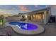 Private backyard oasis featuring a pool and covered patio, perfect for relaxing and entertaining at 10775 E Peralta Canyon Dr, Gold Canyon, AZ 85118