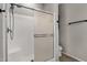 Shower with glass doors, white tile, and a hand-held sprayer at 10775 E Peralta Canyon Dr, Gold Canyon, AZ 85118