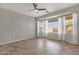 Spacious bedroom with large windows and ceiling fan at 10775 E Peralta Canyon Dr, Gold Canyon, AZ 85118