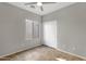 Clean bedroom featuring a ceiling fan and sliding closet doors at 10775 E Peralta Canyon Dr, Gold Canyon, AZ 85118
