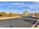 Gated entrance to a community with desert landscaping and beautiful sky at 10775 E Peralta Canyon Dr, Gold Canyon, AZ 85118