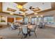 Spacious community room with tables, chairs, and natural light at 10775 E Peralta Canyon Dr, Gold Canyon, AZ 85118