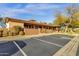 Community clubhouse featuring covered porch and accessible parking at 10775 E Peralta Canyon Dr, Gold Canyon, AZ 85118