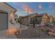 A desert landscaped home featuring cacti, decorative lighting, and inviting pathway to the front door at 10775 E Peralta Canyon Dr, Gold Canyon, AZ 85118