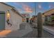 Inviting home featuring desert landscape with cacti and stone, exterior lighting and a decorated front door at 10775 E Peralta Canyon Dr, Gold Canyon, AZ 85118