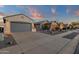 A row of houses showcases desert landscaping and well-maintained exteriors, perfect for curb appeal at 10775 E Peralta Canyon Dr, Gold Canyon, AZ 85118