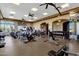 Spacious gym featuring modern equipment, multiple ceiling fans and abundant natural light from large windows at 10775 E Peralta Canyon Dr, Gold Canyon, AZ 85118