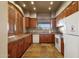 Kitchen with oak cabinets, stone countertops, and modern appliances at 10775 E Peralta Canyon Dr, Gold Canyon, AZ 85118