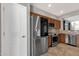 Well-lit kitchen with stainless steel appliances and wooden cabinets at 10775 E Peralta Canyon Dr, Gold Canyon, AZ 85118