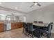Gourmet kitchen featuring stainless steel appliances, tile backsplash, and an island with seating at 10775 E Peralta Canyon Dr, Gold Canyon, AZ 85118