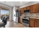 Modern kitchen with stainless steel appliances and access to the outdoor patio, offering a seamless living experience at 10775 E Peralta Canyon Dr, Gold Canyon, AZ 85118