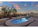Desert-landscaped backyard featuring a private pool enclosed by desert landscape and metal fencing at 10775 E Peralta Canyon Dr, Gold Canyon, AZ 85118