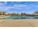 Community pool with desert views, sun umbrellas and comfortable lounge chairs at 10775 E Peralta Canyon Dr, Gold Canyon, AZ 85118