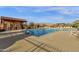 Community pool, including a covered patio with restroom facilities and lounge seating at 10775 E Peralta Canyon Dr, Gold Canyon, AZ 85118