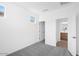 Neutral-toned bedroom with large windows and soft gray carpet at 10860 E Tiburon Ave, Mesa, AZ 85212