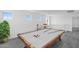 Bright bonus room with a pool table and lots of natural light at 10860 E Tiburon Ave, Mesa, AZ 85212