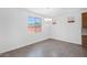 Bright dining area with tile floors, modern light fixture, and large windows at 10860 E Tiburon Ave, Mesa, AZ 85212
