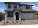 Beautiful two-story home with a two car garage, neutral color palette, and well maintained front yard at 10860 E Tiburon Ave, Mesa, AZ 85212