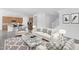 Inviting living area with stylish furnishings, tile flooring, and views of an adjacent kitchen and staircase at 10860 E Tiburon Ave, Mesa, AZ 85212