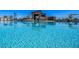 Community pool with lounge chairs and umbrellas at 10860 E Tiburon Ave, Mesa, AZ 85212