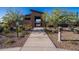 Inviting entrance to the community pool area with a well-maintained pathway and lush landscaping at 10860 E Tiburon Ave, Mesa, AZ 85212