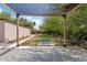 Landscaped backyard boasts a shaded patio, putting green, and mature trees at 1117 W Glenrosa Ave, Phoenix, AZ 85013
