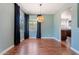 Charming dining room with unique light fixture and elegant dark curtains at 1117 W Glenrosa Ave, Phoenix, AZ 85013