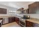 Well-equipped kitchen featuring stainless steel appliances and granite countertops at 1117 W Glenrosa Ave, Phoenix, AZ 85013