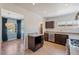 Updated kitchen with stainless steel appliances and an adjacent dining area at 1117 W Glenrosa Ave, Phoenix, AZ 85013
