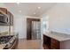 Bright kitchen features stainless steel appliances, granite counters, and tile floors at 1117 W Glenrosa Ave, Phoenix, AZ 85013
