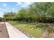 Artificial putting green with plants and trees at 1117 W Glenrosa Ave, Phoenix, AZ 85013