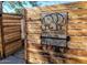 Woodlea Melrose Tool Shed signage on wooden fence with open gate at 1117 W Glenrosa Ave, Phoenix, AZ 85013