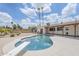 Spacious backyard boasts a sparkling in-ground pool and diving board, perfect for outdoor entertaining at 11631 N 30Th St, Phoenix, AZ 85028
