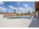 Backyard oasis complete with a refreshing pool, desert landscaping, and privacy wall at 11631 N 30Th St, Phoenix, AZ 85028